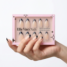 Hand holding a box of Ellie Vincy Nails press-on nails with a white background